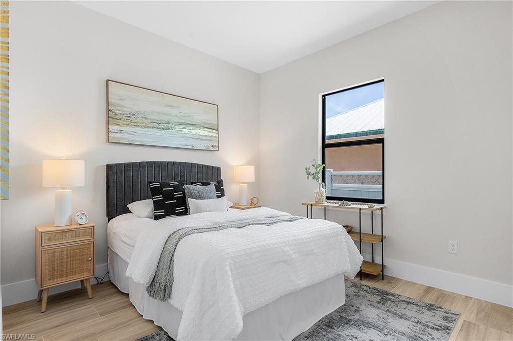 Bedroom with baseboards and light wood-style flooring