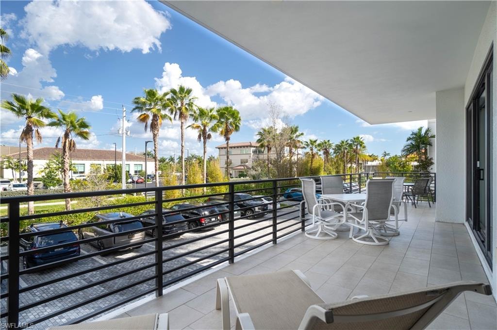 Balcony with a residential view and outdoor dining area