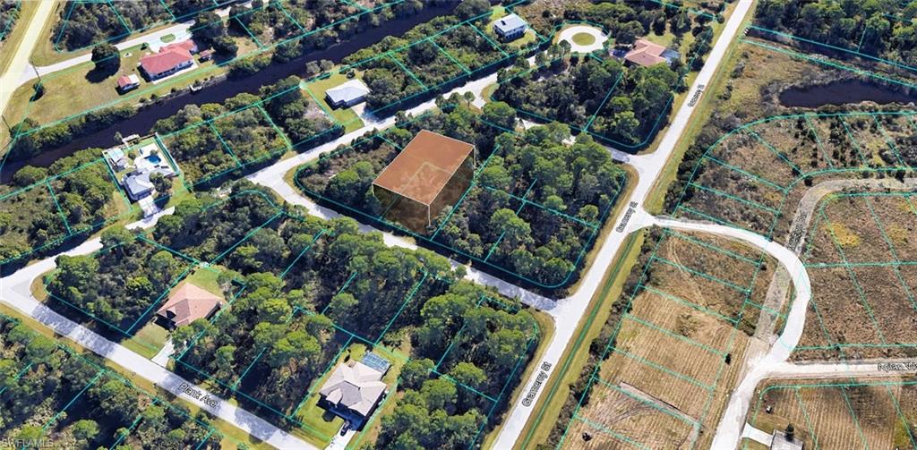 Aerial overview of property's location featuring property parcel outlined