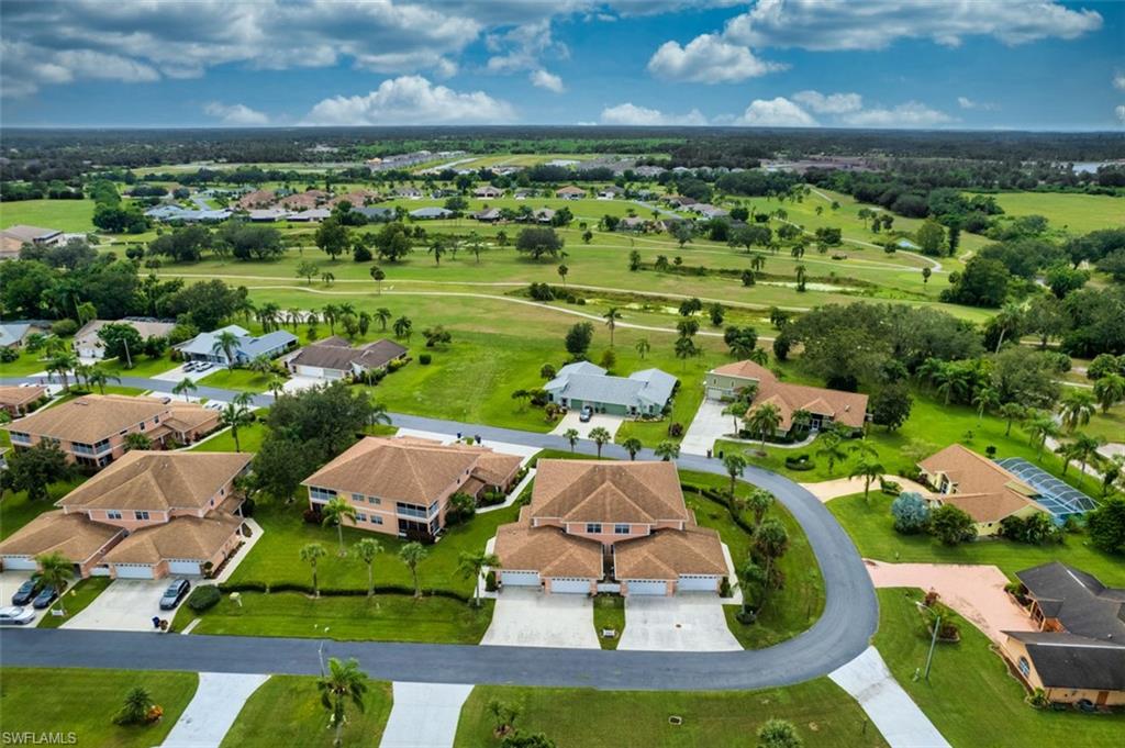 Aerial perspective of suburban area featuring a local golf course