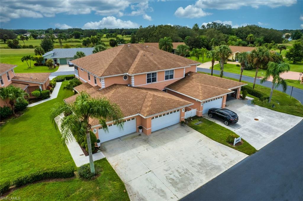 View from above of property with a tree filled landscape