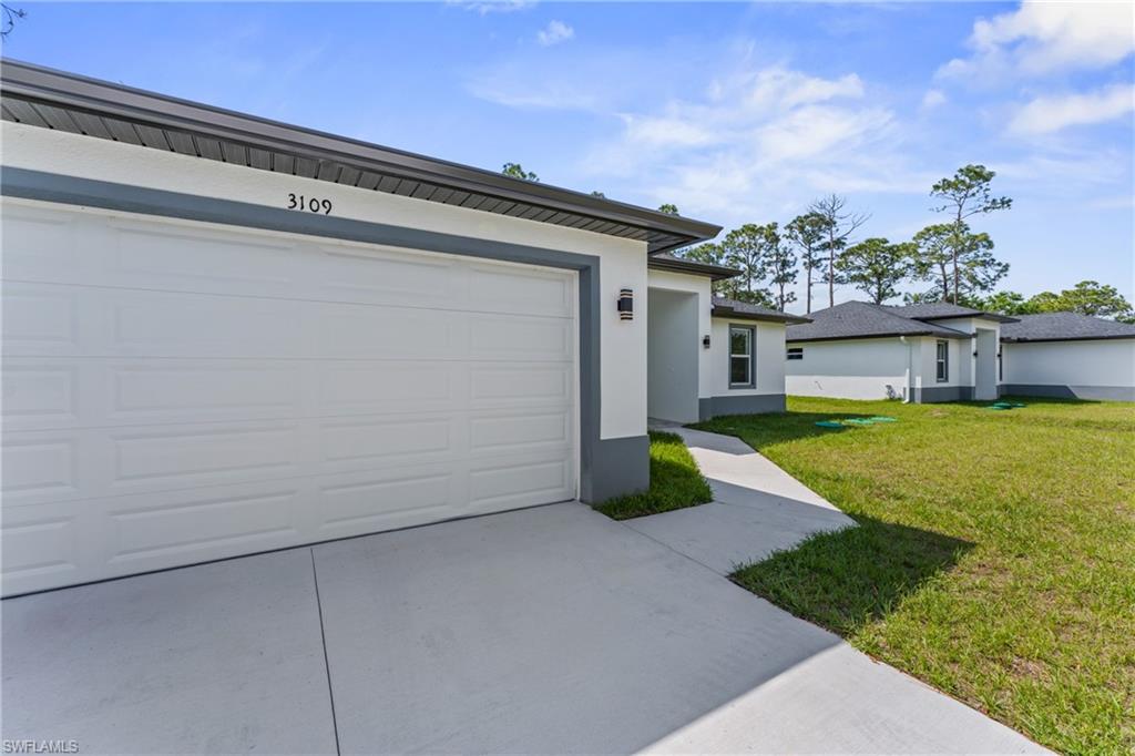 Garage with concrete driveway