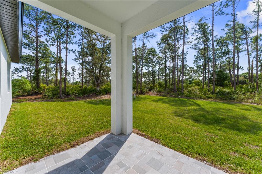 View of yard with a patio