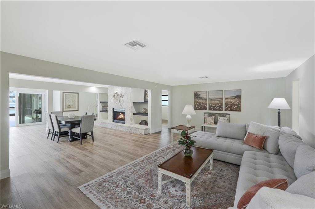 Living area featuring a fireplace and wood finished floors
