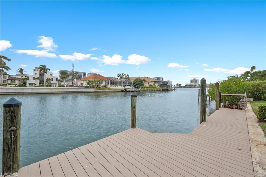 Dock featuring a water view and a residential view