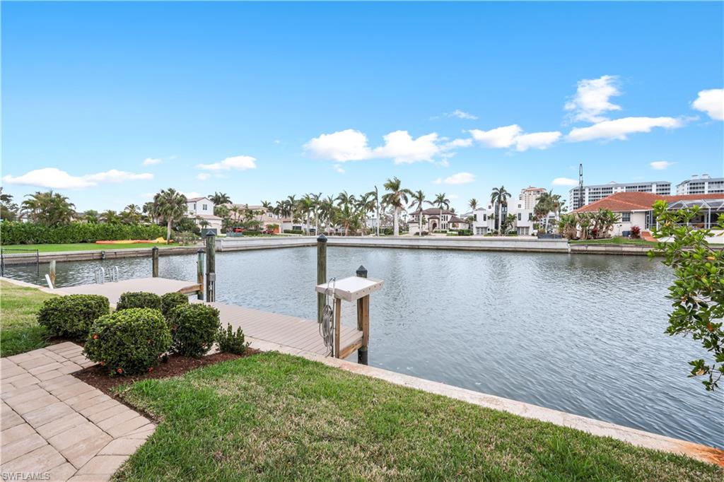 Dock area featuring a water view