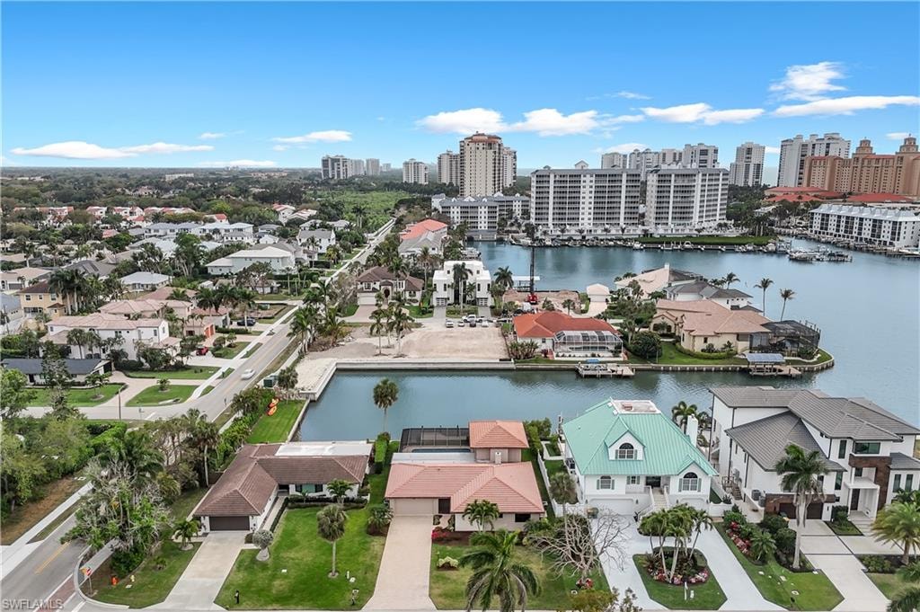 Aerial view of a nearby body of water and city skyline