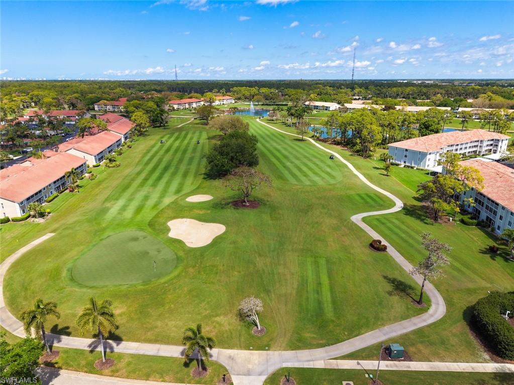 Drone / aerial view of a large body of water and a golf course