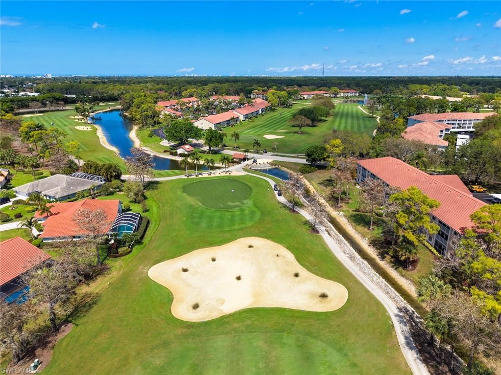 Aerial view of a local golf course and a nearby body of water