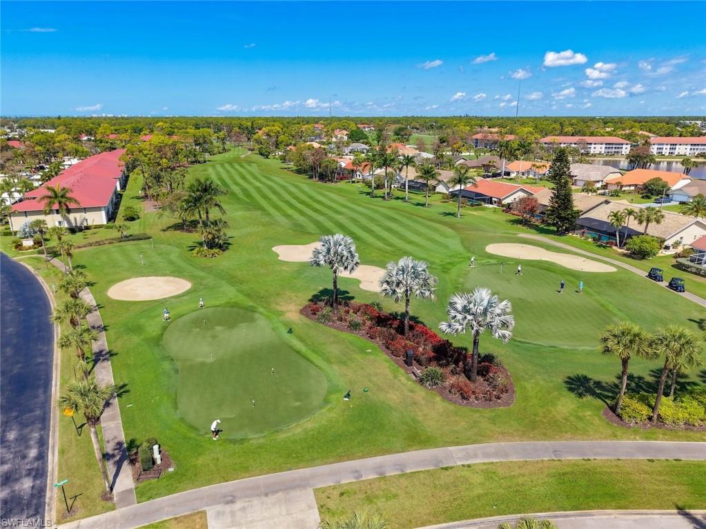 Aerial perspective of suburban area featuring a golf club
