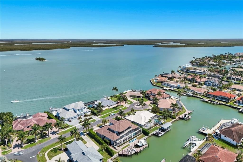 Aerial view of residential area with a nearby body of water