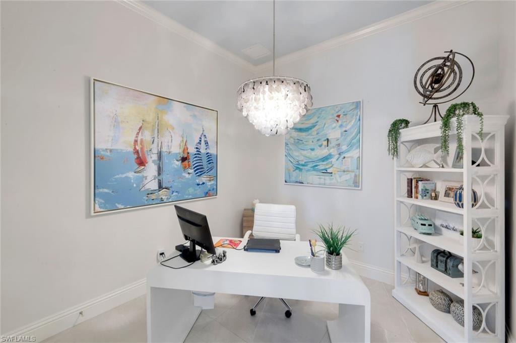 Office space with a chandelier and ornamental molding