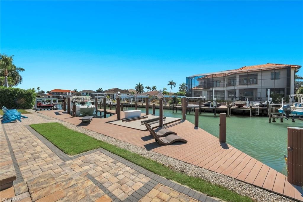 Dock area with a water view and boat lift