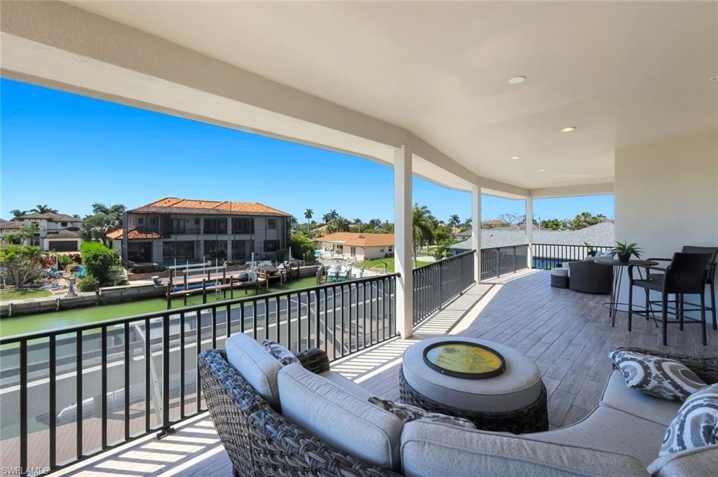View of patio with a water view and a residential view