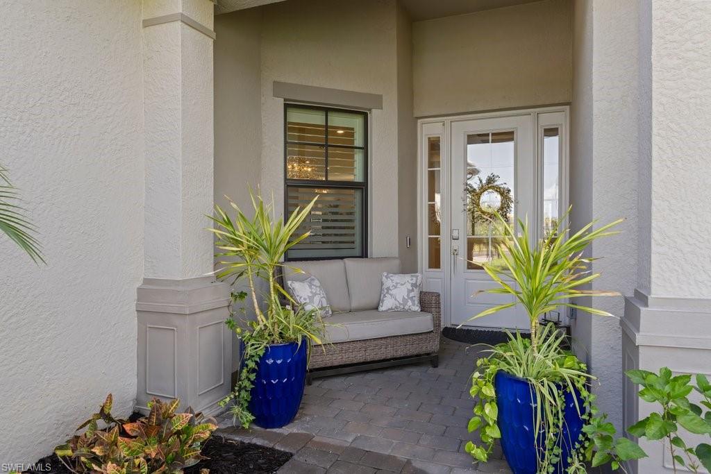 View of exterior entry with stucco siding