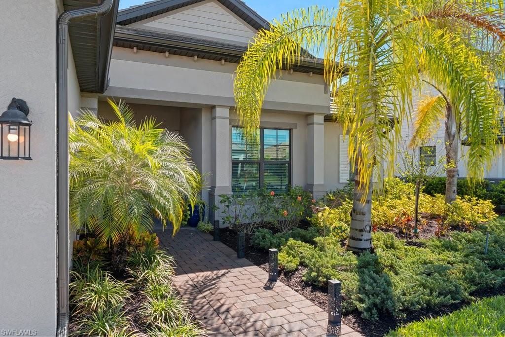 View of exterior entry with stucco siding