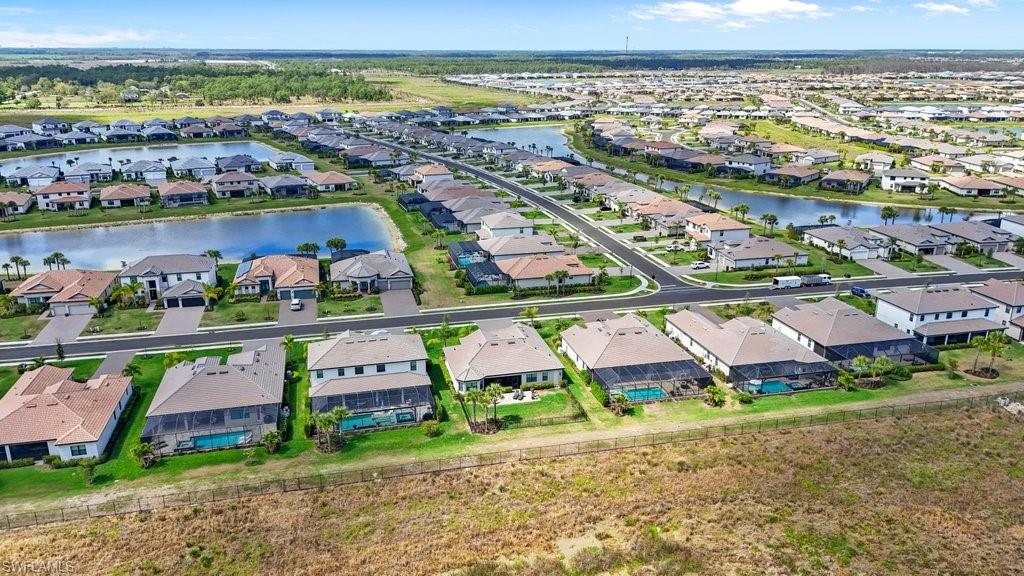 Aerial perspective of suburban area with a large body of water