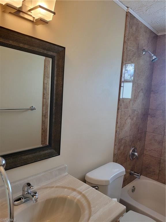 Full bathroom with vanity, washtub / shower combination, and crown molding