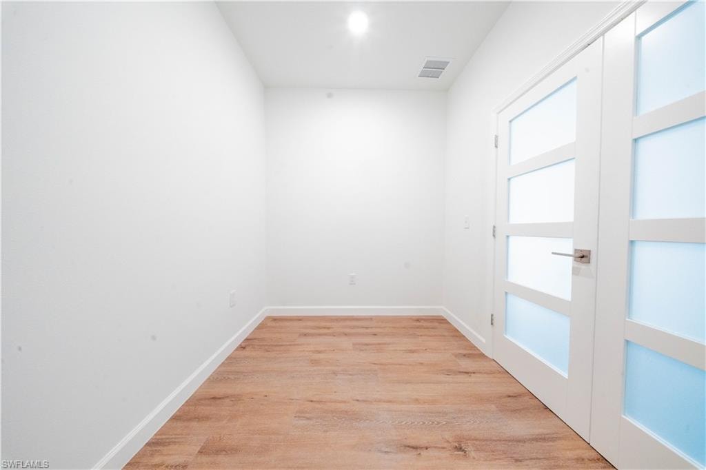 Empty room with light wood-style floors
