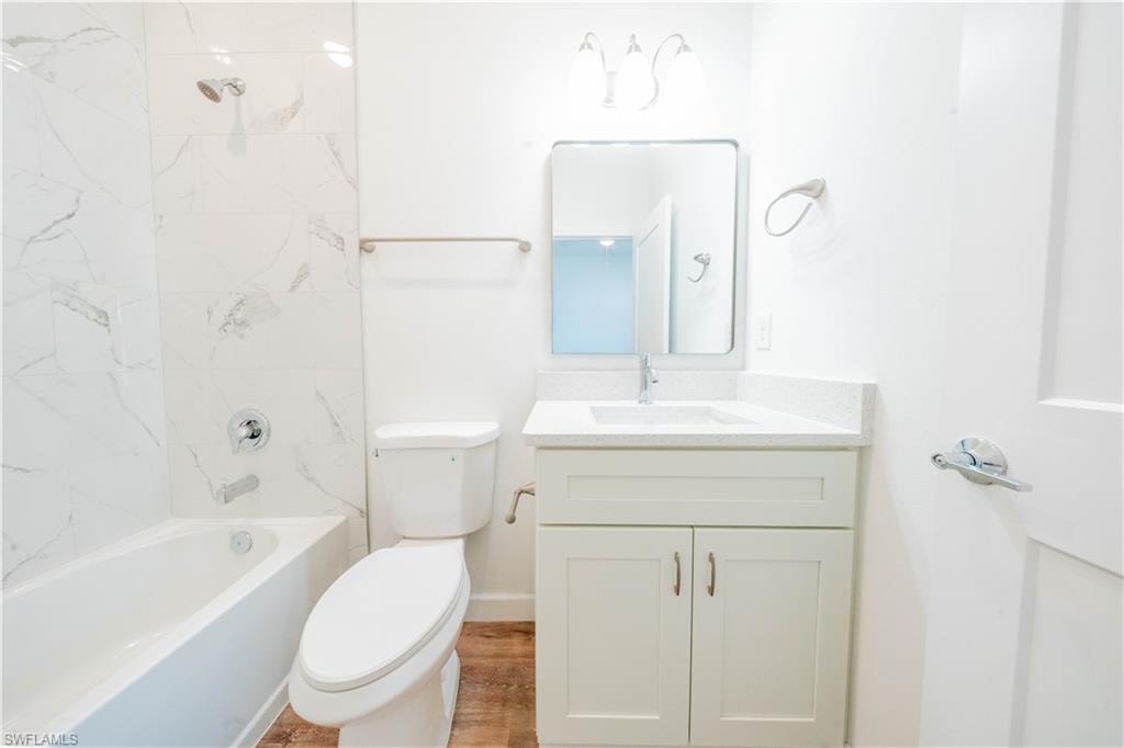 Full bath featuring vanity and tub / shower combination