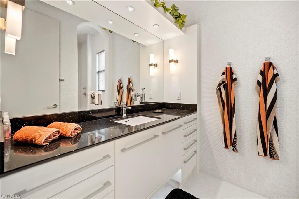 Guest full bath featuring vanity