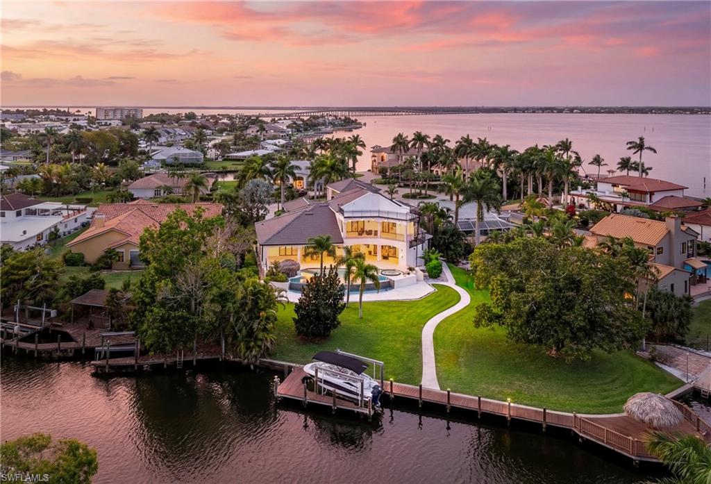 Aerial perspective of suburban area with a nearby body of water