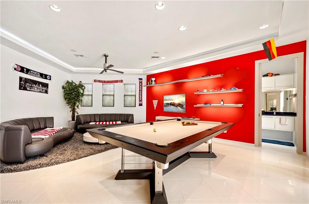 Playroom with a ceiling fan, billiards, a tray ceiling, and recessed lighting