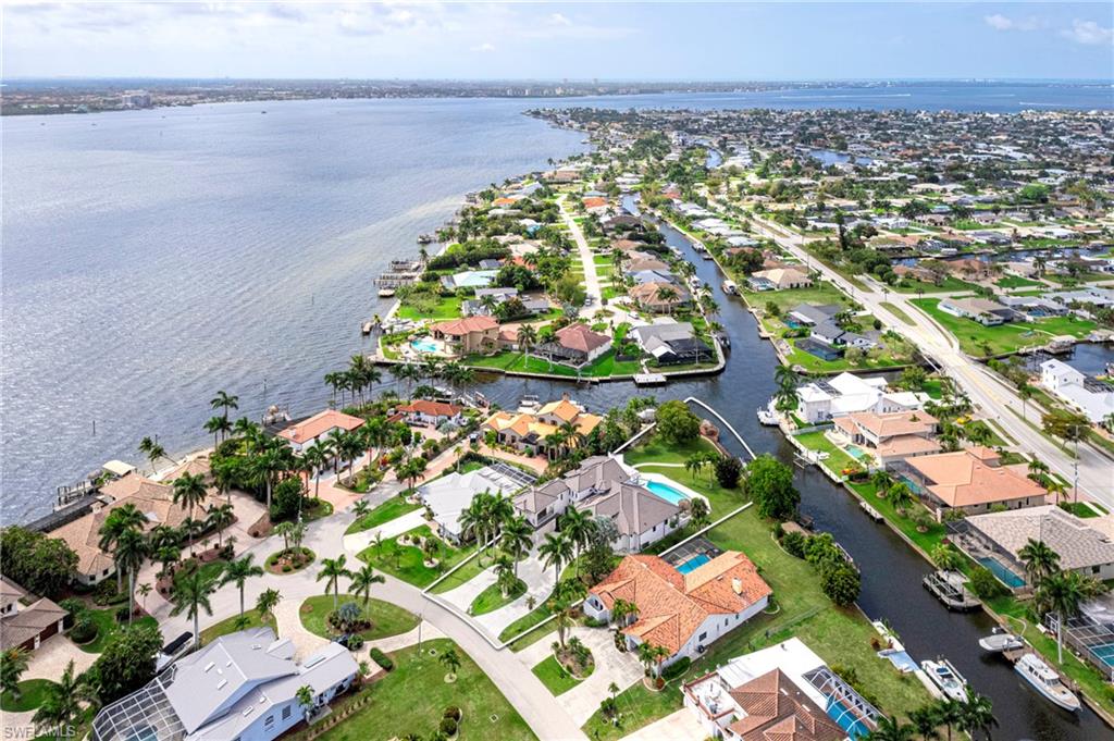 Aerial view of residential area featuring a large body of water