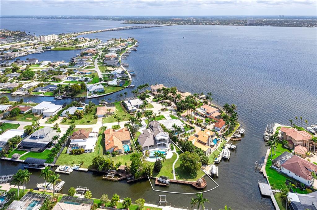 Aerial perspective of suburban area with a large body of water
