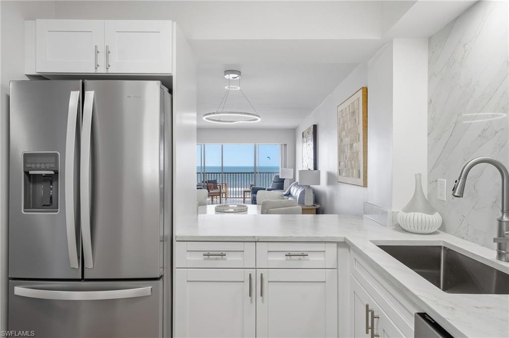The newly renovated kitchen features new cabinetry and updated appliances for both style and function.