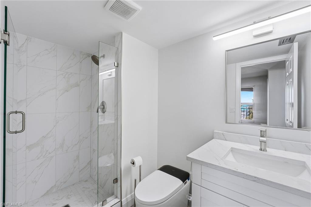 The guest bath has been tastefully remodeled with stylish finishes and smart toilet technology.