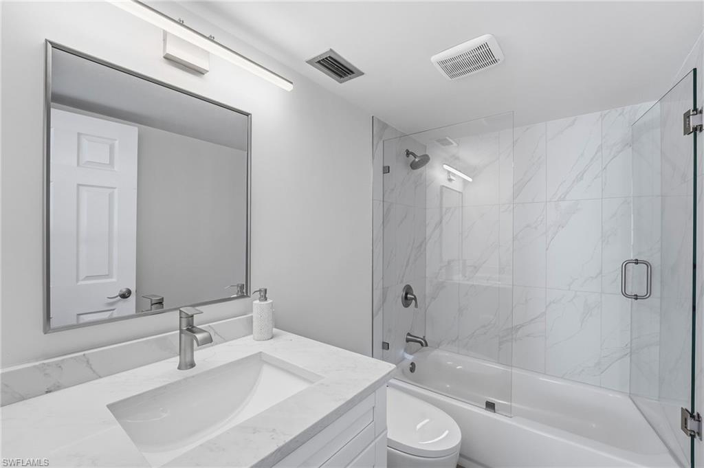The remodeled primary bath features modern finishes and smart upgrades.
