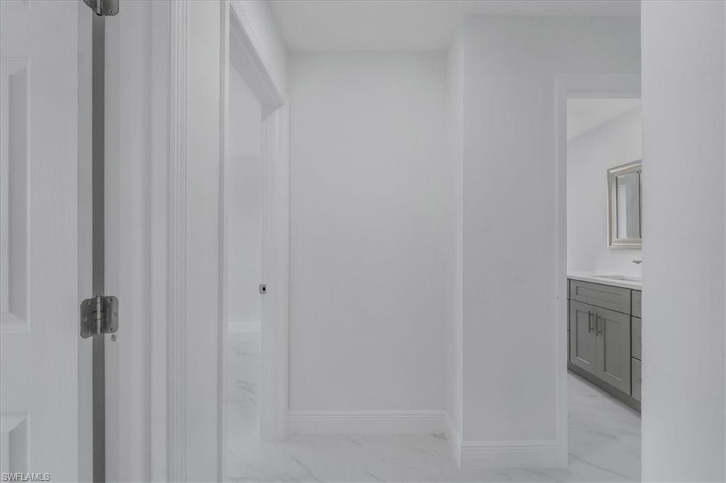 Bathroom featuring vanity and baseboards