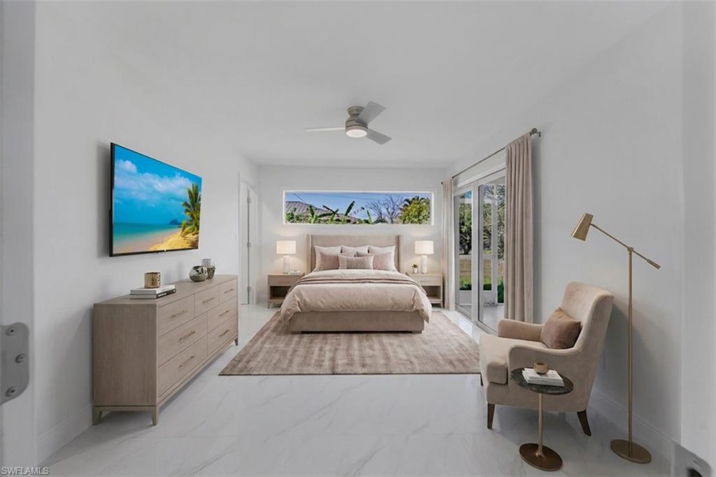 Bright interior featuring white tile flooring, a horizontal window, and a ceiling fan