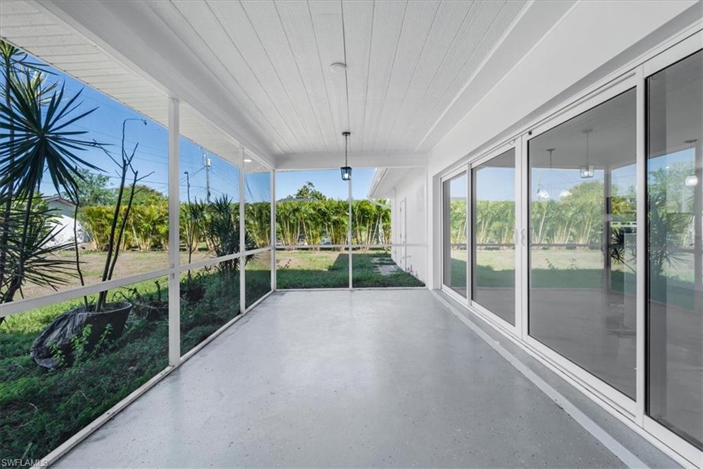 Unfurnished sunroom featuring wooden ceiling