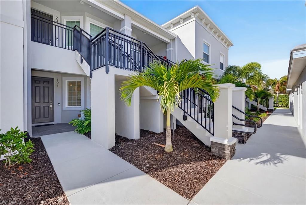 Entrance to property with stucco siding