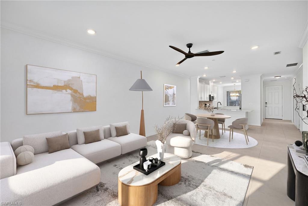 Living room featuring a ceiling fan, crown molding, and recessed lighting