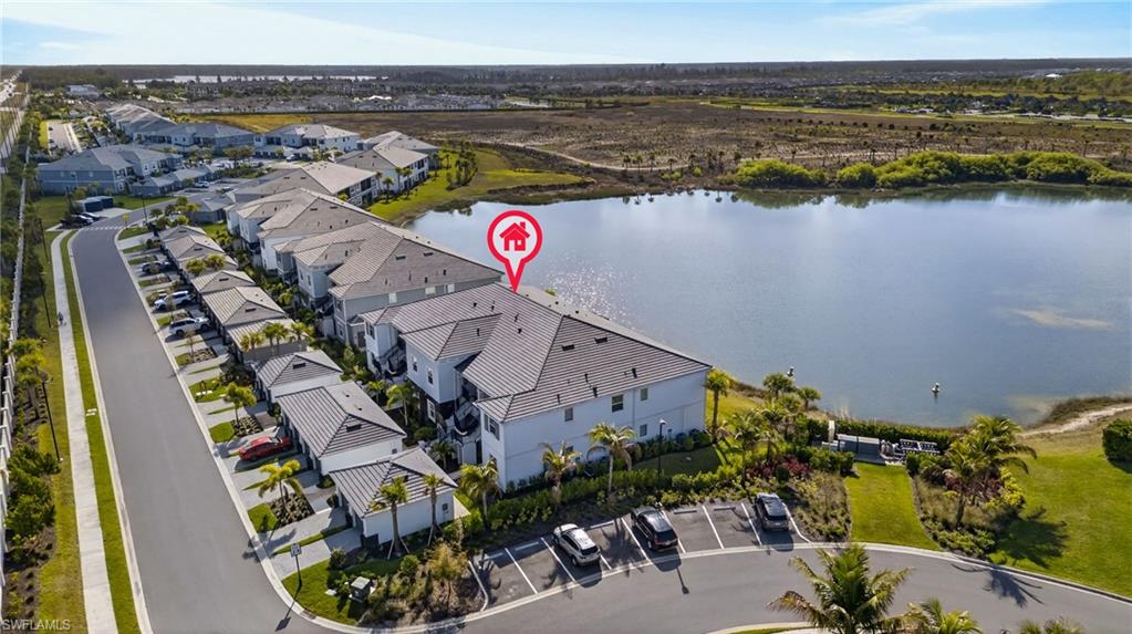 Aerial perspective of suburban area with a large body of water