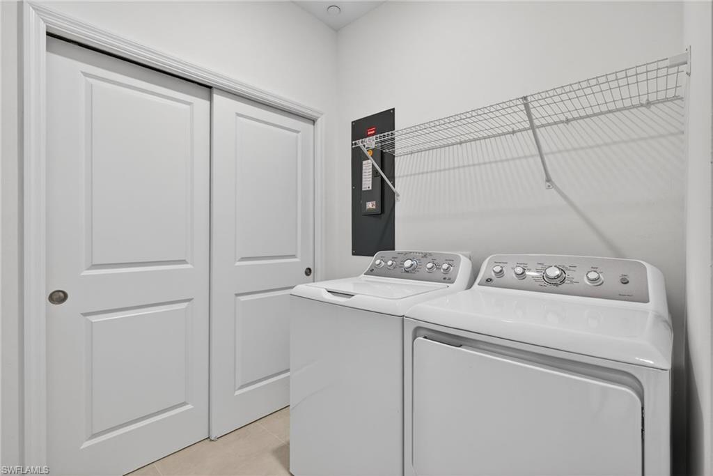 Laundry room featuring washing machine and clothes dryer
