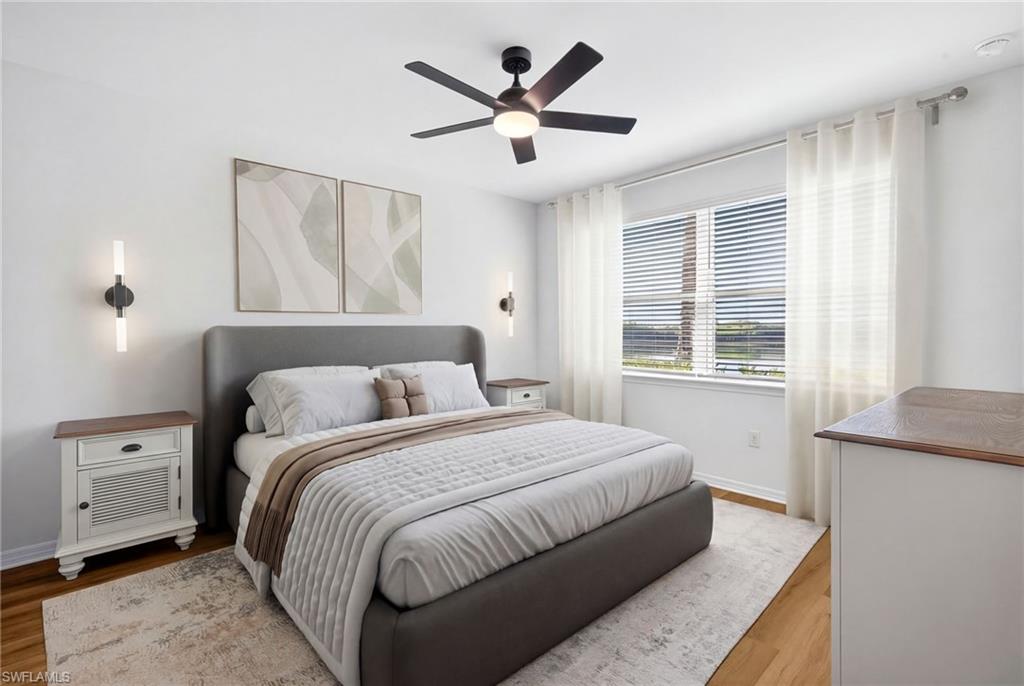 Bedroom featuring ceiling fan and wood finished floors