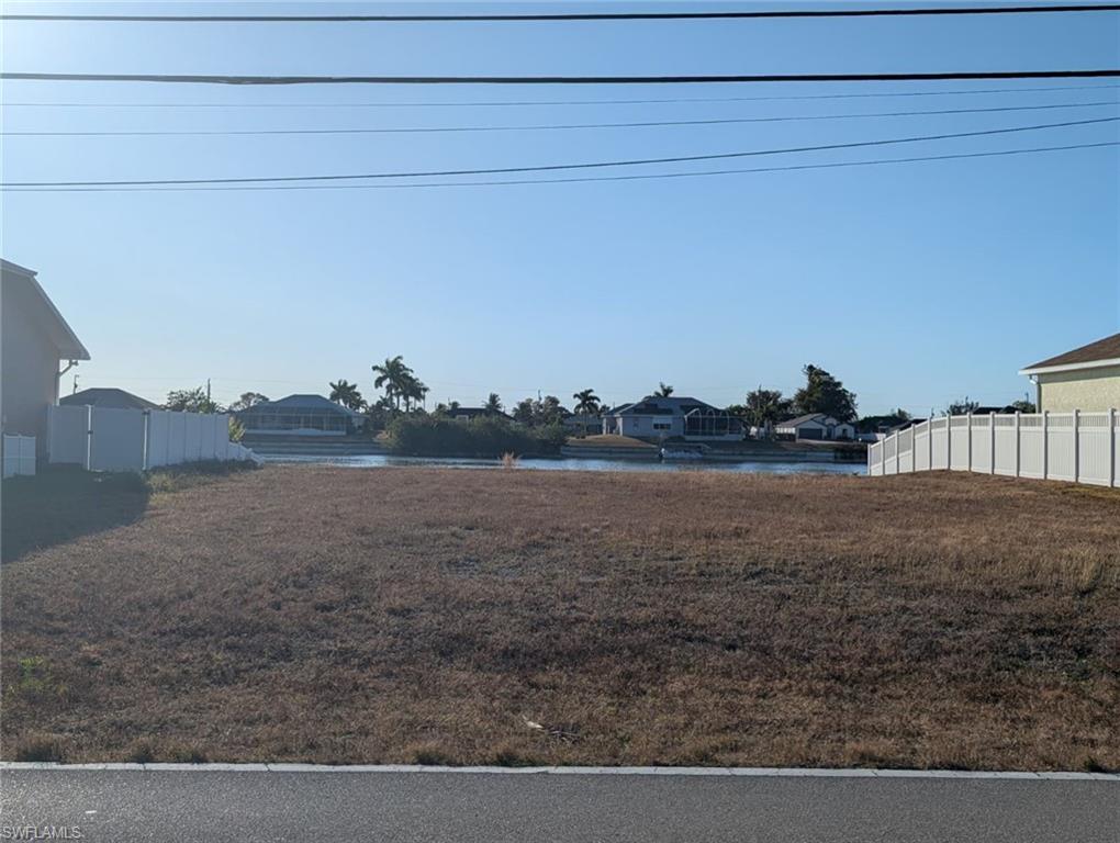 View of yard with a water view