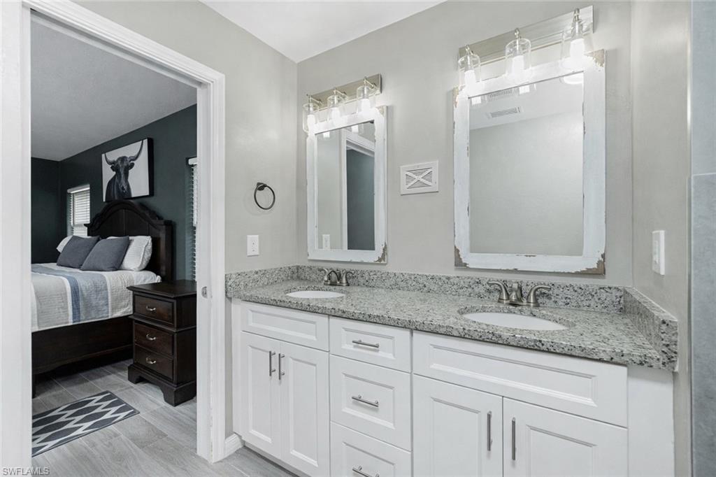 Ensuite bathroom featuring double vanity