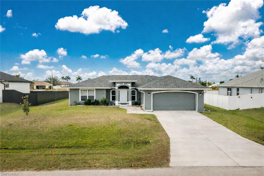 Ranch-style home with a garage, stucco siding, concrete driveway, and a shingled roof