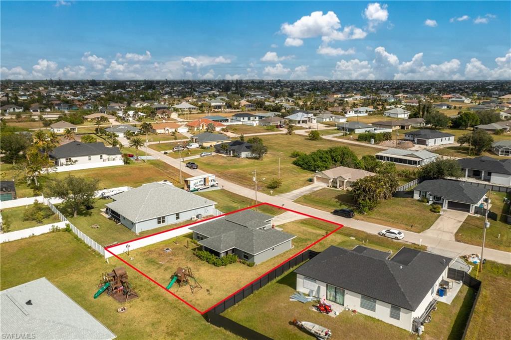 Aerial perspective of suburban area with property boundaries highlighted
