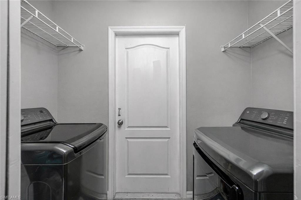 Laundry area with washing machine and clothes dryer