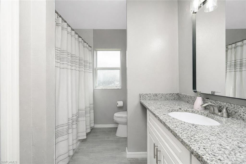 Bathroom with vanity and a shower with curtain