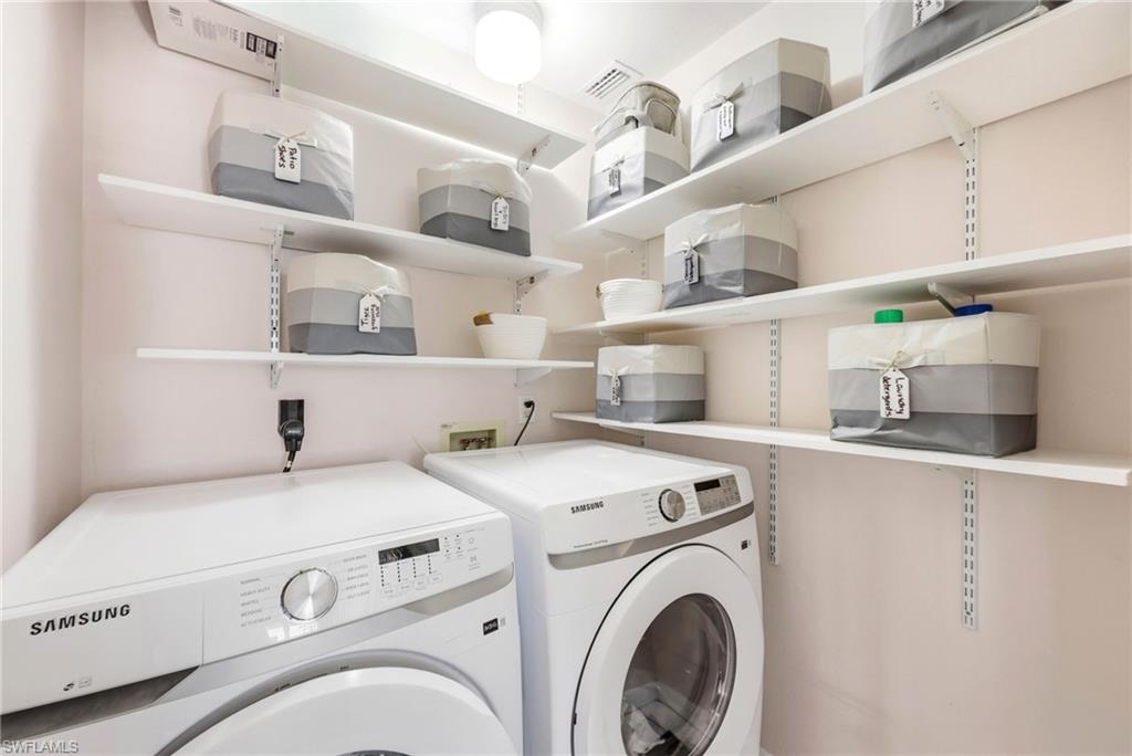 Laundry room with washing machine and dryer
