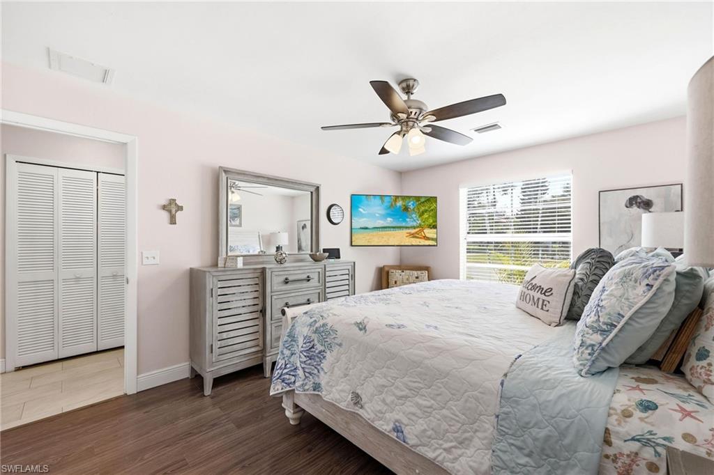 Bedroom with wood finished floors and a ceiling fan
