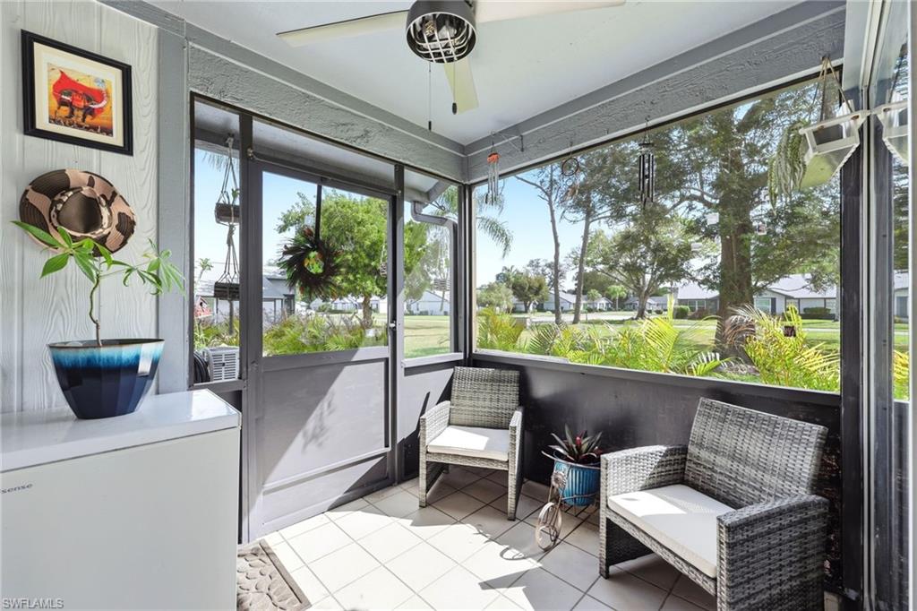 Sunroom featuring a ceiling fan