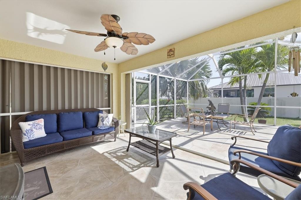 Sunroom / solarium featuring a patio area, outdoor lounge area, and ceiling fan